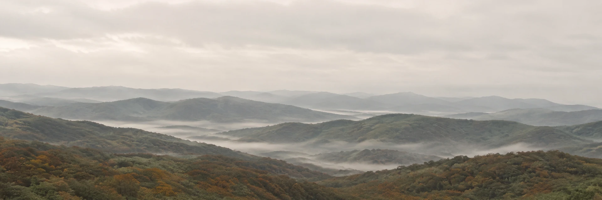 Soft misty ridgelines at dawn